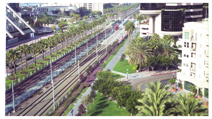 A color photograph of a city showing a rail line